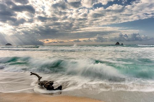 Free Captivating waves crashing on Aïn Zouit Beach, Algeria under a dramatic cloudy sky. Stock Photo