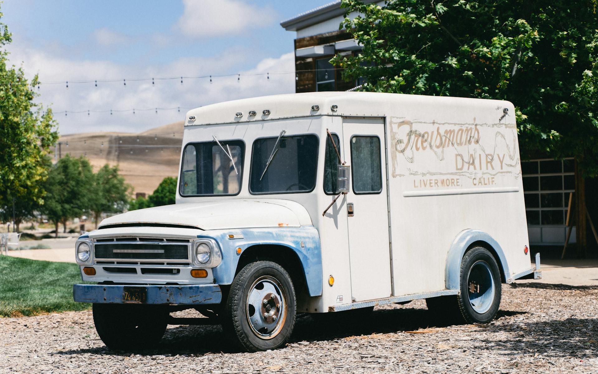 Old dairy delivery truck parked in Livermore, CA, showcasing rustic charm outdoors.