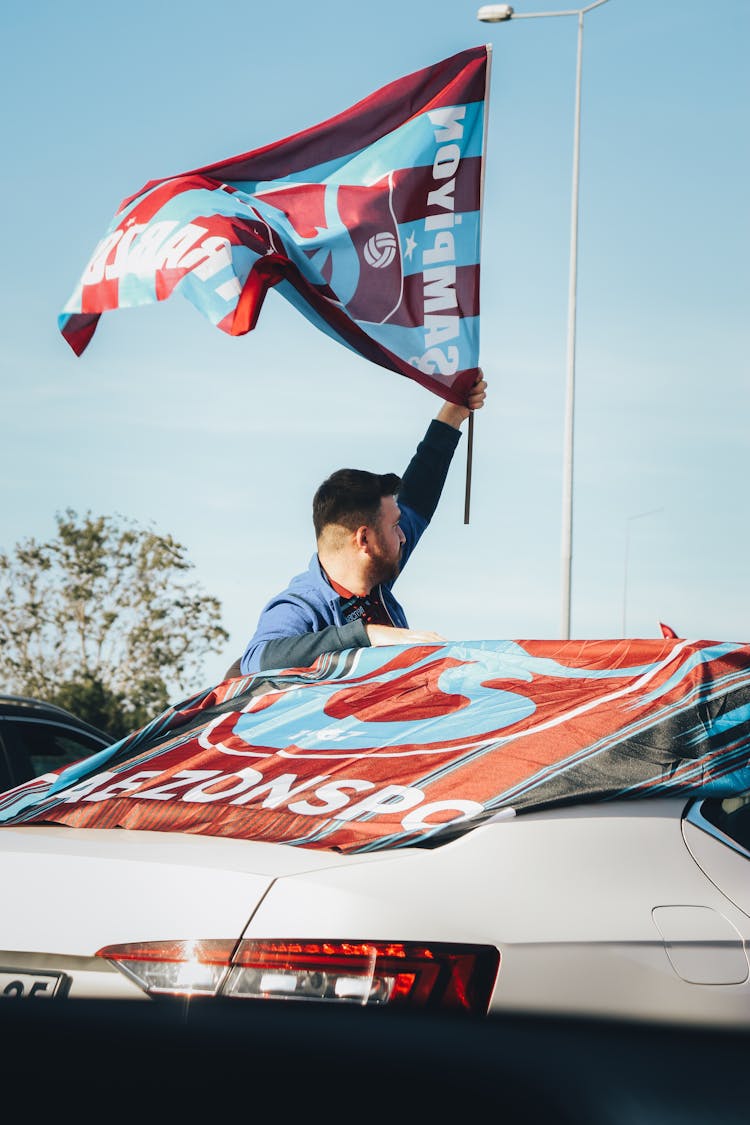 Man Holding A Flag At The Auto Racing Festival