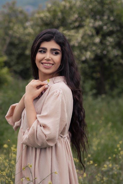 Woman in Beige Dress Smiling