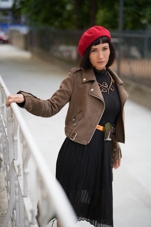 A Woman in Brown Coat Wearing Red Beret