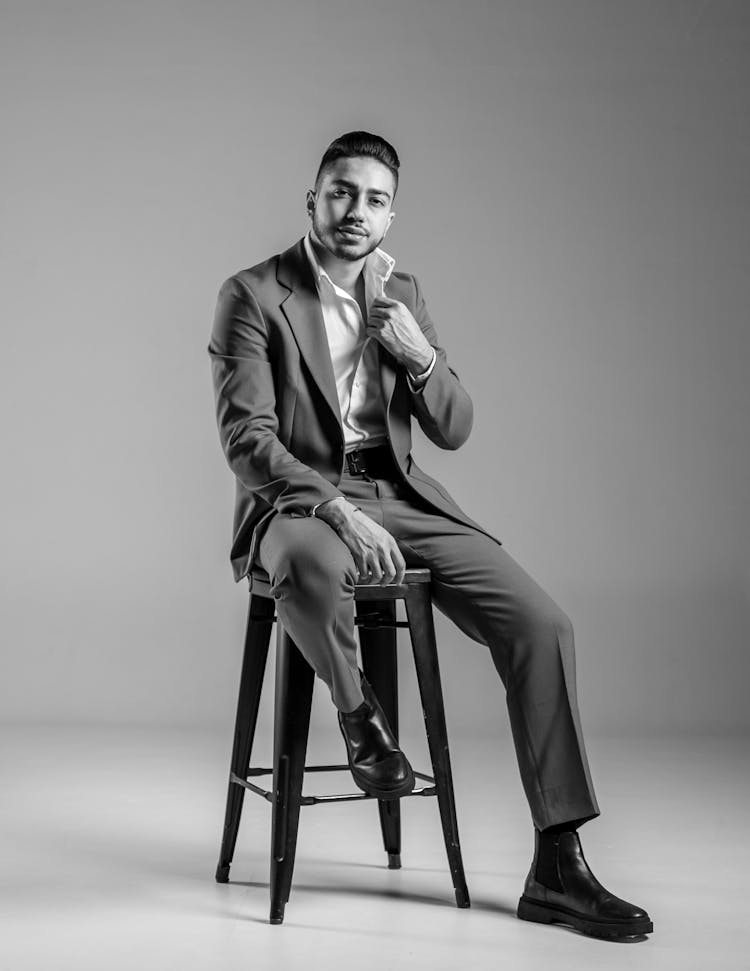 Man In Suit Posing In Black And White