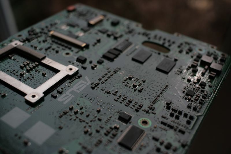 Laptop motherboard showing CPU socket and Intel-branded integrated circuits