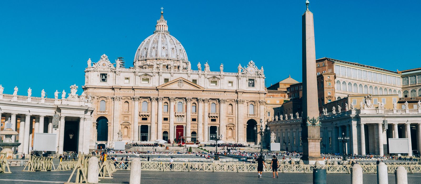 Stunning daylight view of St. Peter's Basilica and Square in Vatican City.