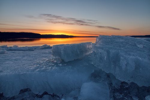 Free Breathtaking view of a sunset over a frozen lake with icy chunks in Lake City, MN. Stock Photo