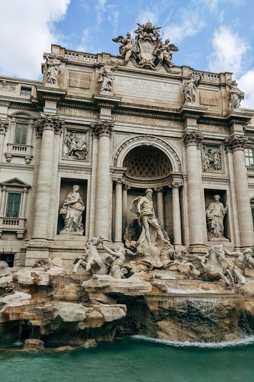 Gray Concrete Building with Statues