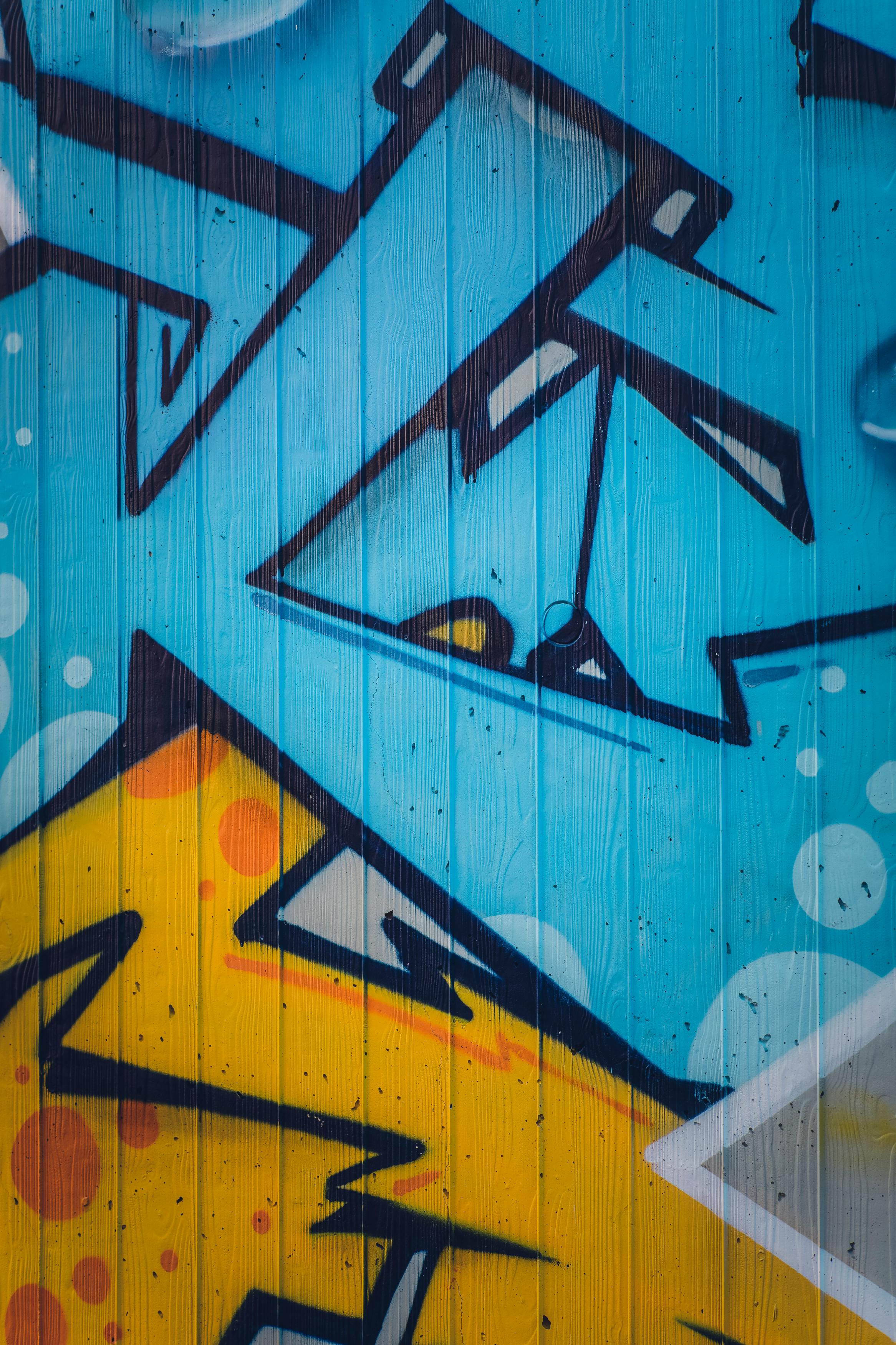 blue and yellow wall graffiti