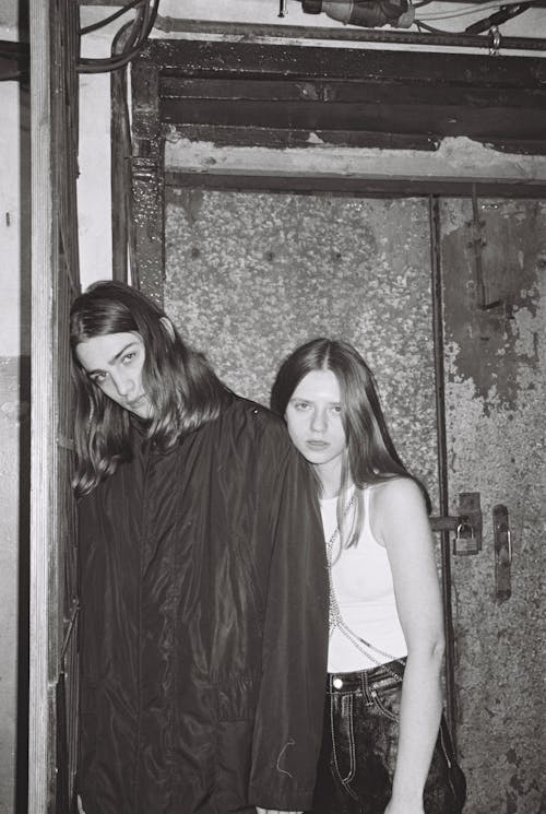 Free Teenage Boy and Girl with Long Hair Posing  Stock Photo