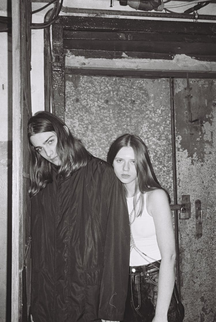 Teenage Boy And Girl With Long Hair Posing 