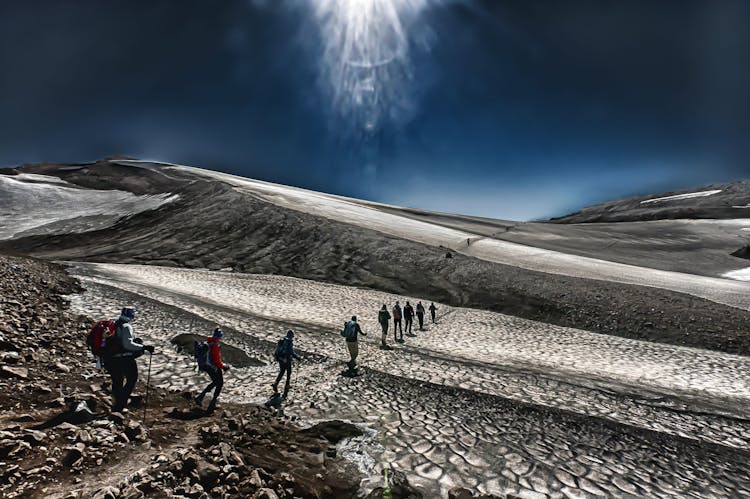 People Hiking On Desert