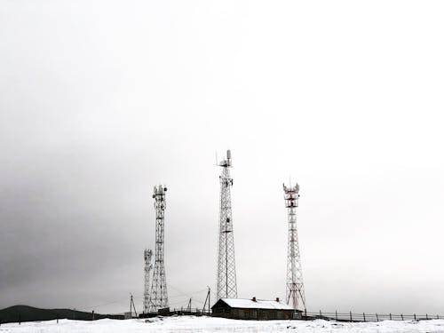 Communication Towers in an Open Field
