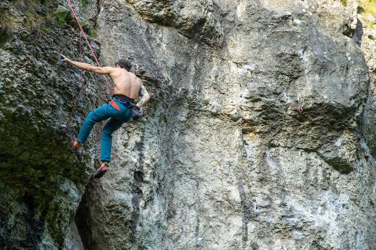 Climber Hanging On A Cliff