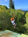 Man in White T-shirt and Black Shorts Sitting on Green Hammock