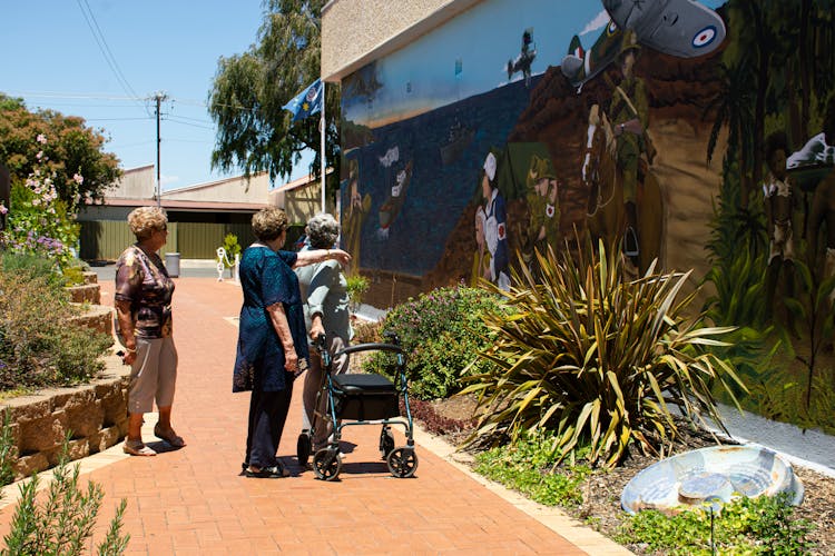 Elderly Women Looking At A Mural