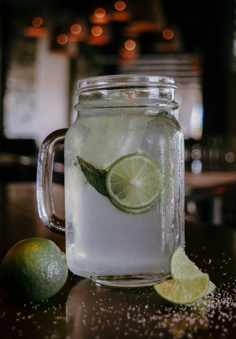 Cocktail On Mason Jar With Lime Slices