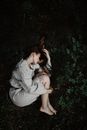 Woman Lying on the Ground in Fetal Position