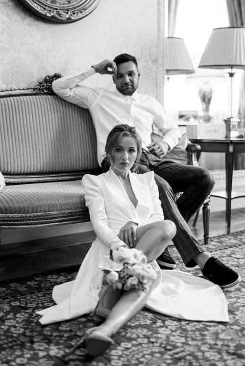 Free Stylish couple posing inside a luxurious living room in black and white. Stock Photo