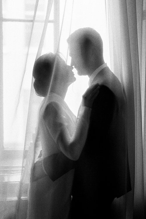 Free Romantic black and white portrait of a couple's intimate wedding moment. Stock Photo