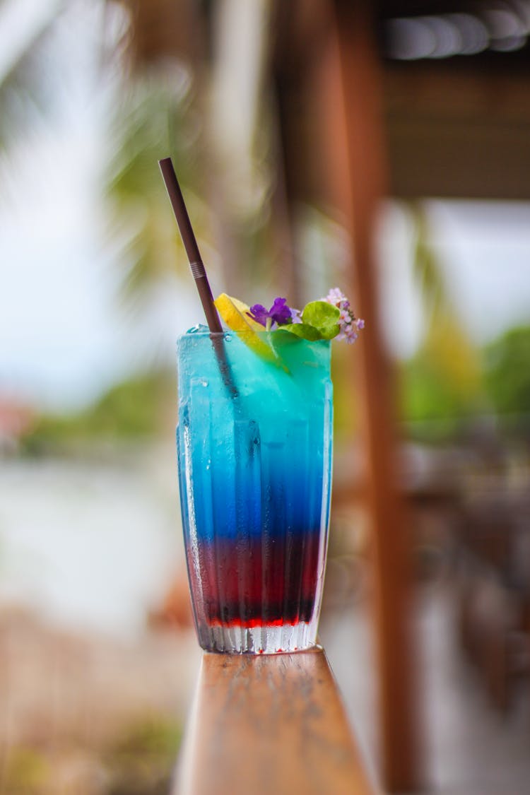 Flowers And Lemon Garnish On Cocktail