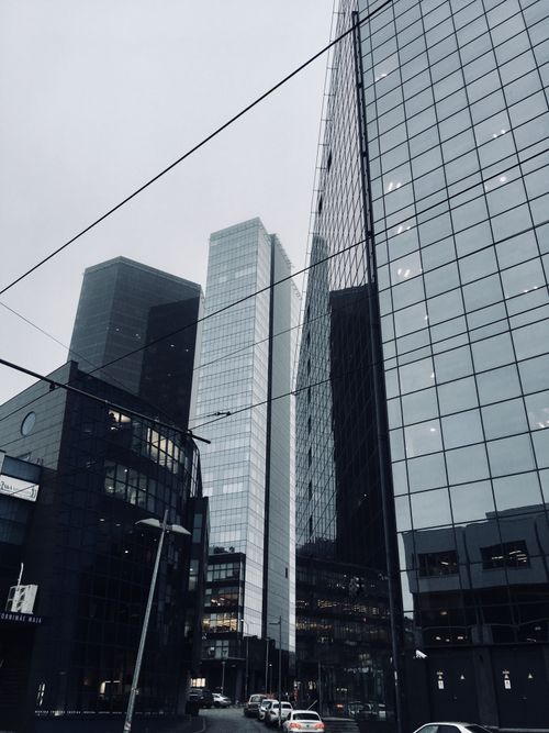 Free Low-angle view of modern glass skyscrapers in Tallinn's urban landscape. Stock Photo