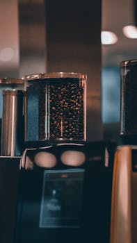 Detailed shot of coffee beans in a modern machine, perfect for caffeine lovers.