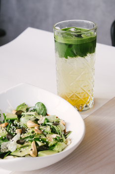 Healthy green salad paired with refreshing mint lemonade for a perfect light meal.