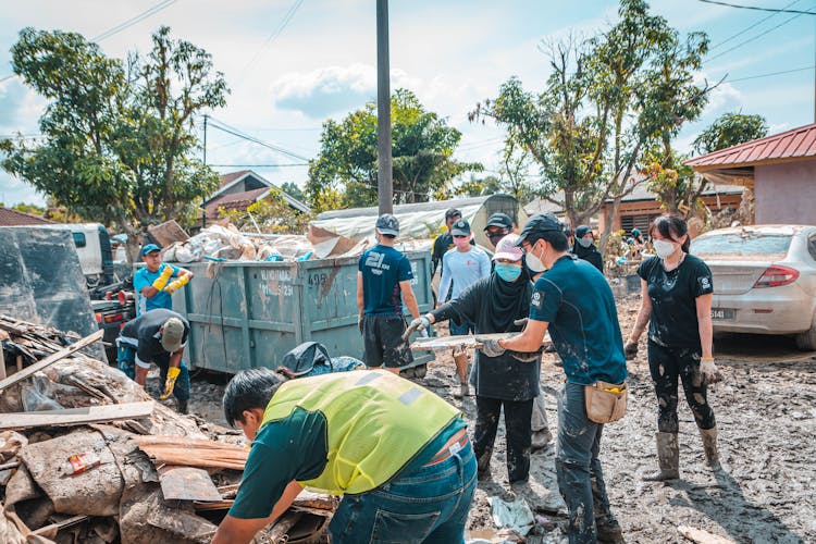 Group Of People Cleaning Together