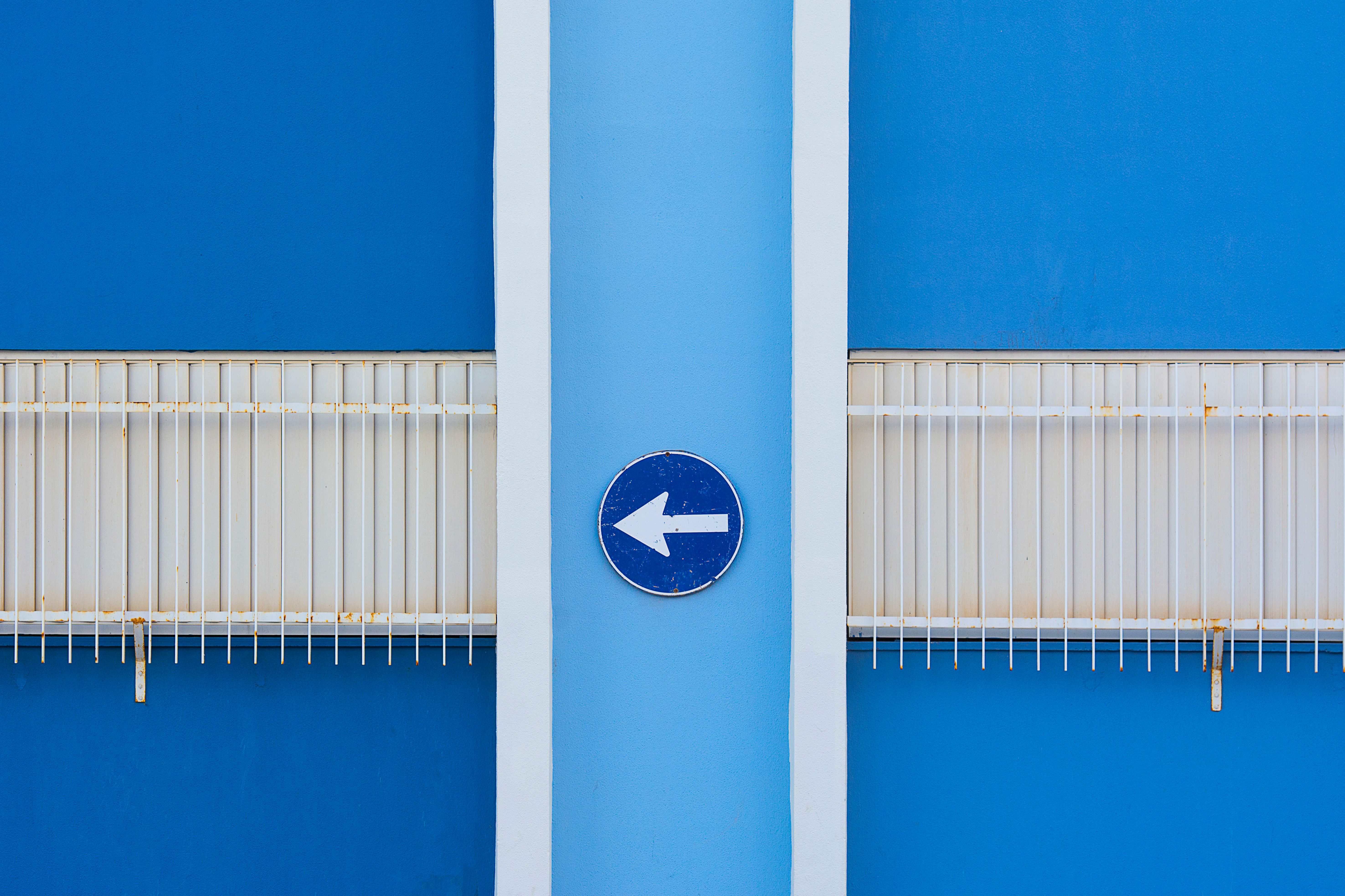 Blue Wall with Arrow Sign