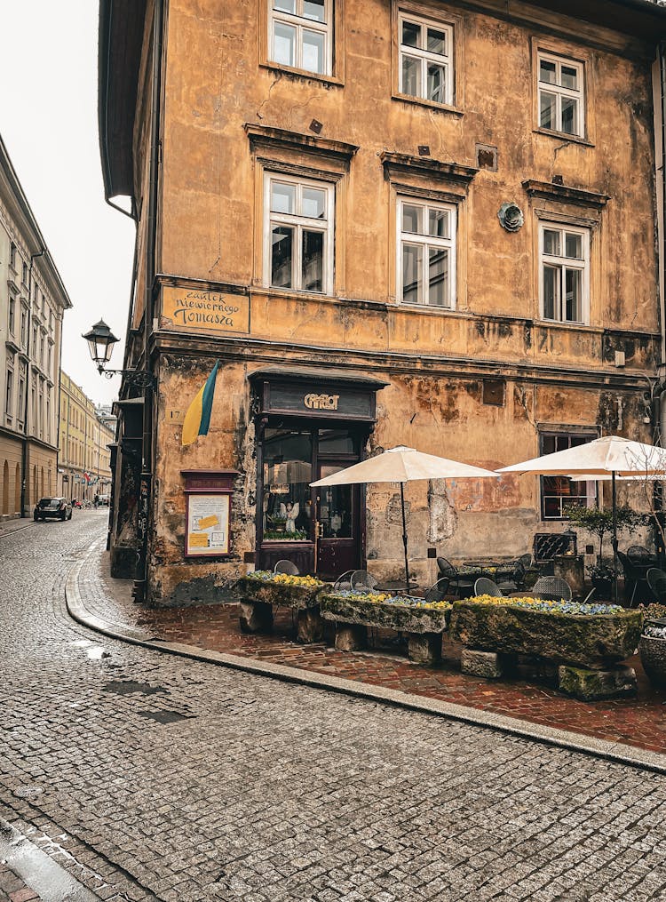 Townhouse Corner With A Cafe, And Cobblestone Pavement