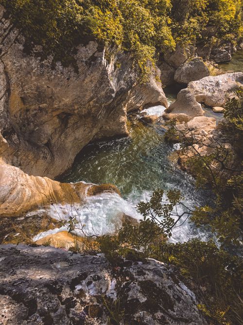 Free Discover the serene beauty of a cascading waterfall amidst Albania's rocky terrain. Stock Photo