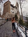 Woman in Black Pants Walking on Gray Concrete Stairs