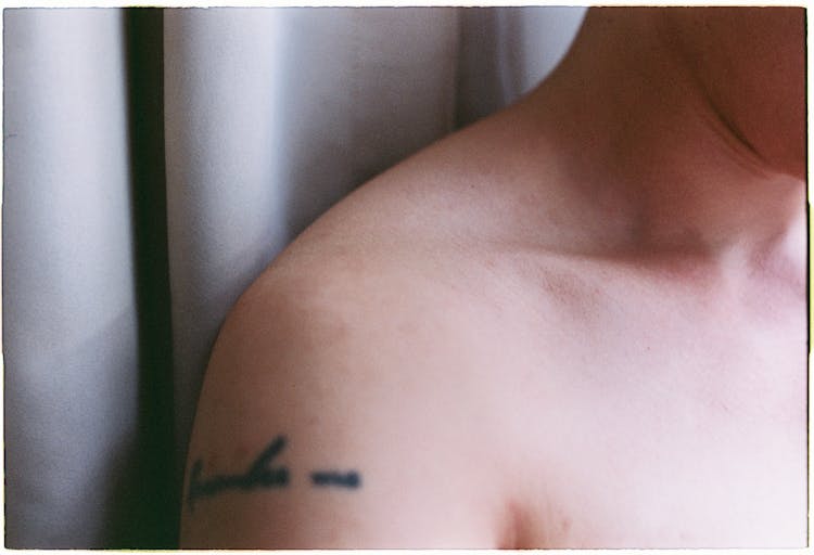 A Person With Tattoo On His Shoulder