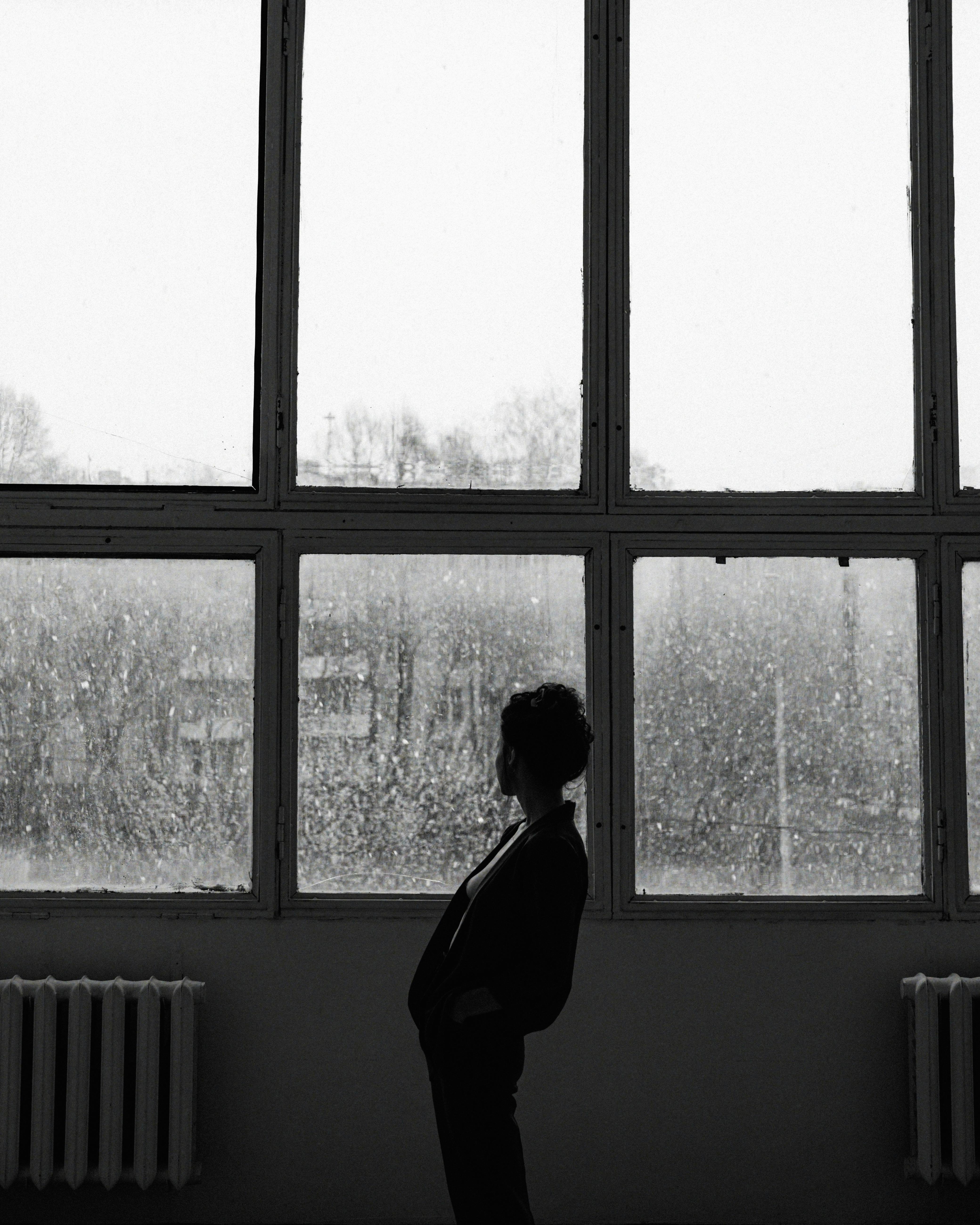 HD wallpaper: Greyscale Photo of Man Looking Through Window, black