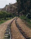Person Walking on Train Rail
