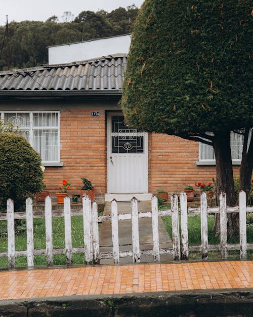 House with a Wooden Fence 