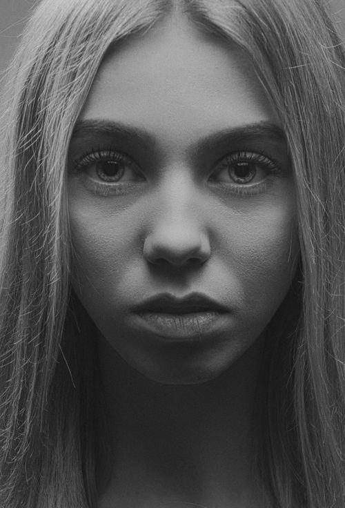 Free Close-up black and white portrait of a young woman with long hair in Kyiv. Stock Photo
