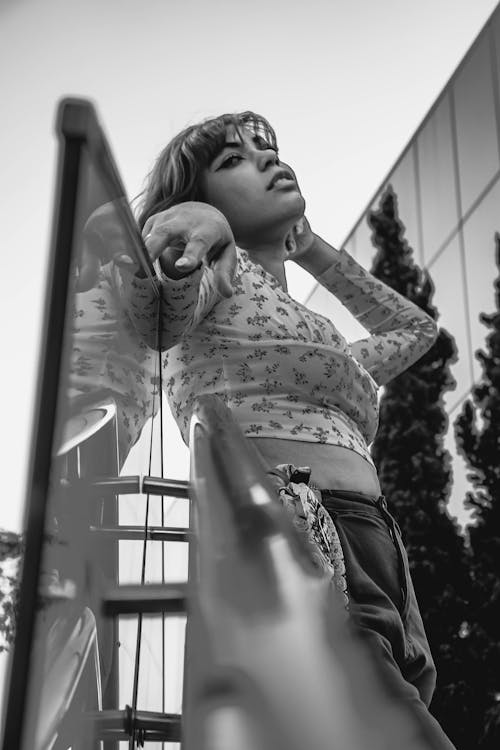 Grayscale Photo of Woman in Floral Top 