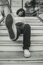 A Woman Wearing White Sneaker