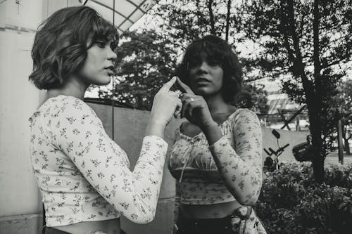 Free Woman Touching a Mirror Stock Photo