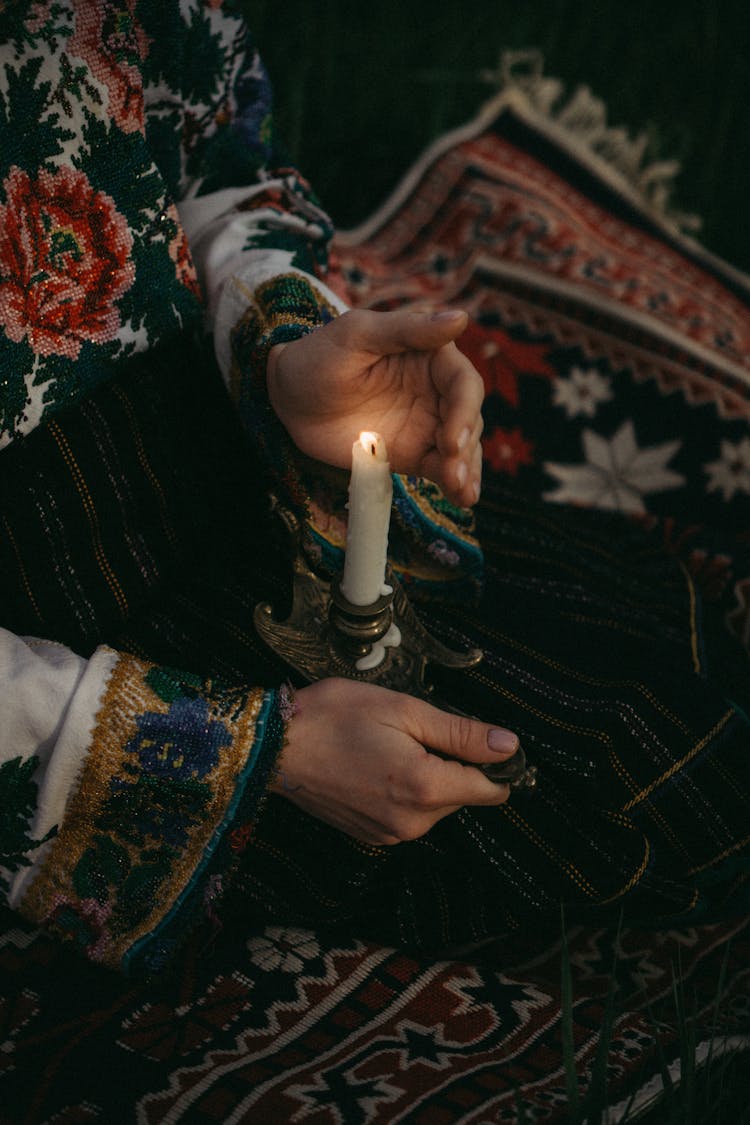 Hands Holding A Lit Candle