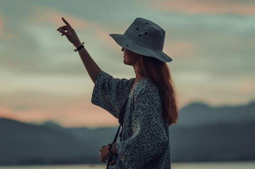 Woman Pointing in the Sky