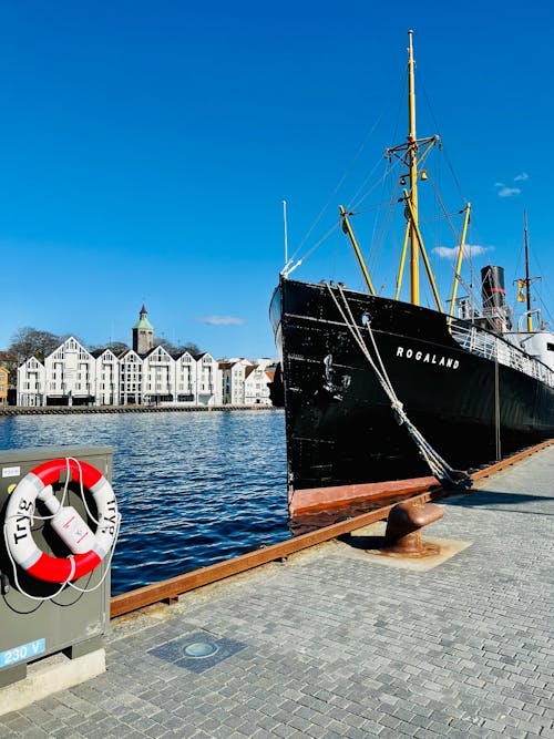 A Ship Docked on the Harbor