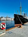 Black and Brown Boat on Dock