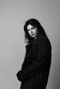 Woman in Black Coat Sitting on Chair