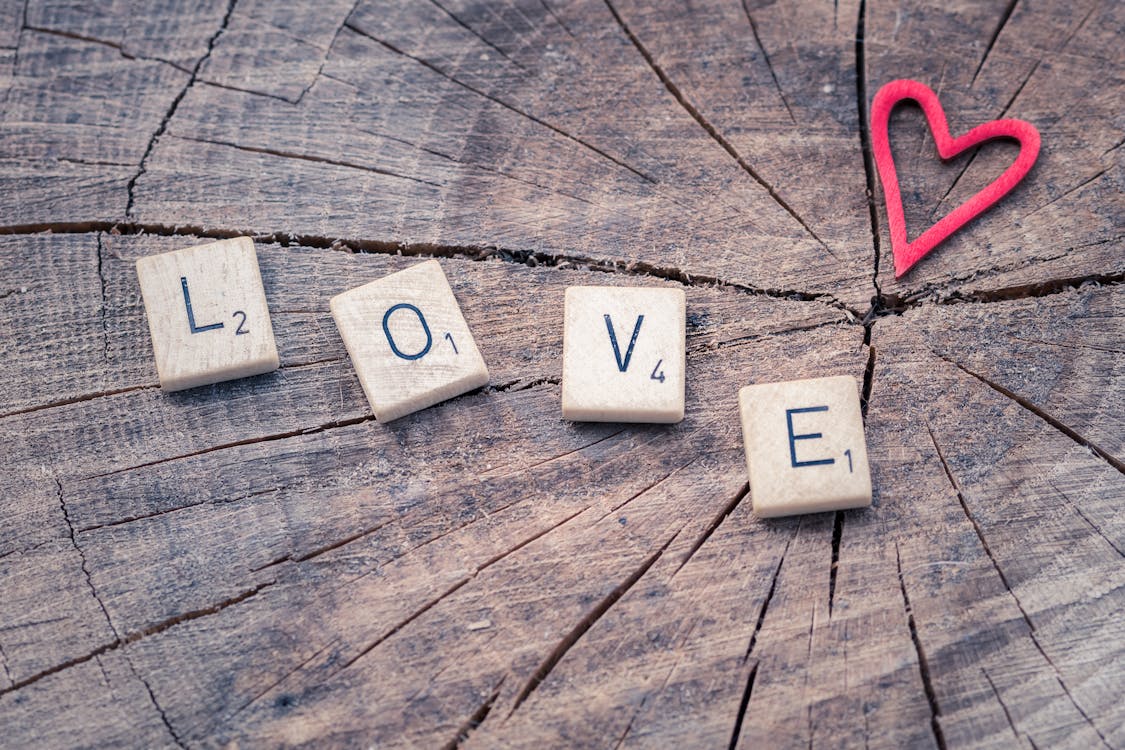 Free Photo of Scrabble Letter Tiles Forming the Word Love. Stock Photo