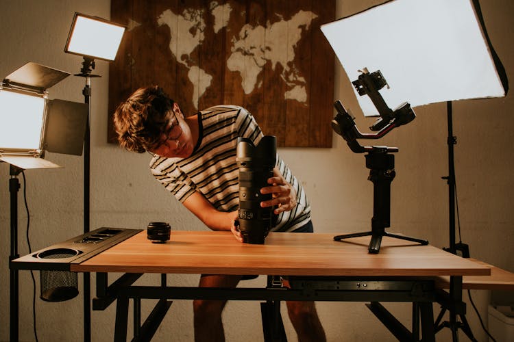 Man Preparing His Camera Lens