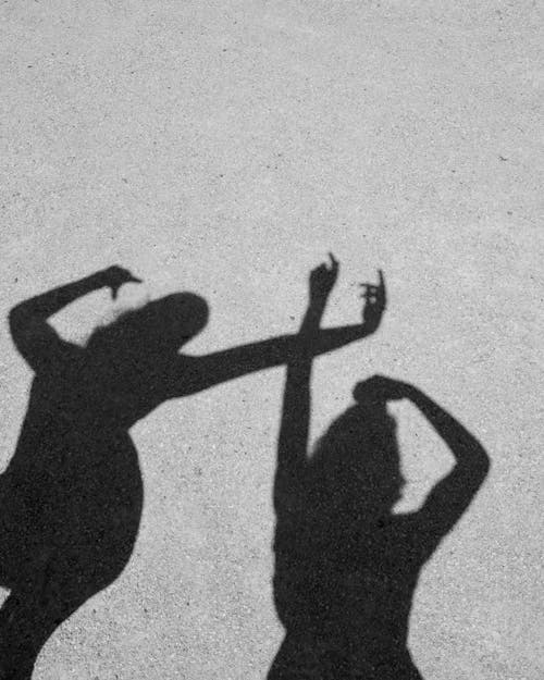 Shadow of People Raising Their Hands 