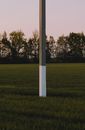 Concrete Post on the Grass Field