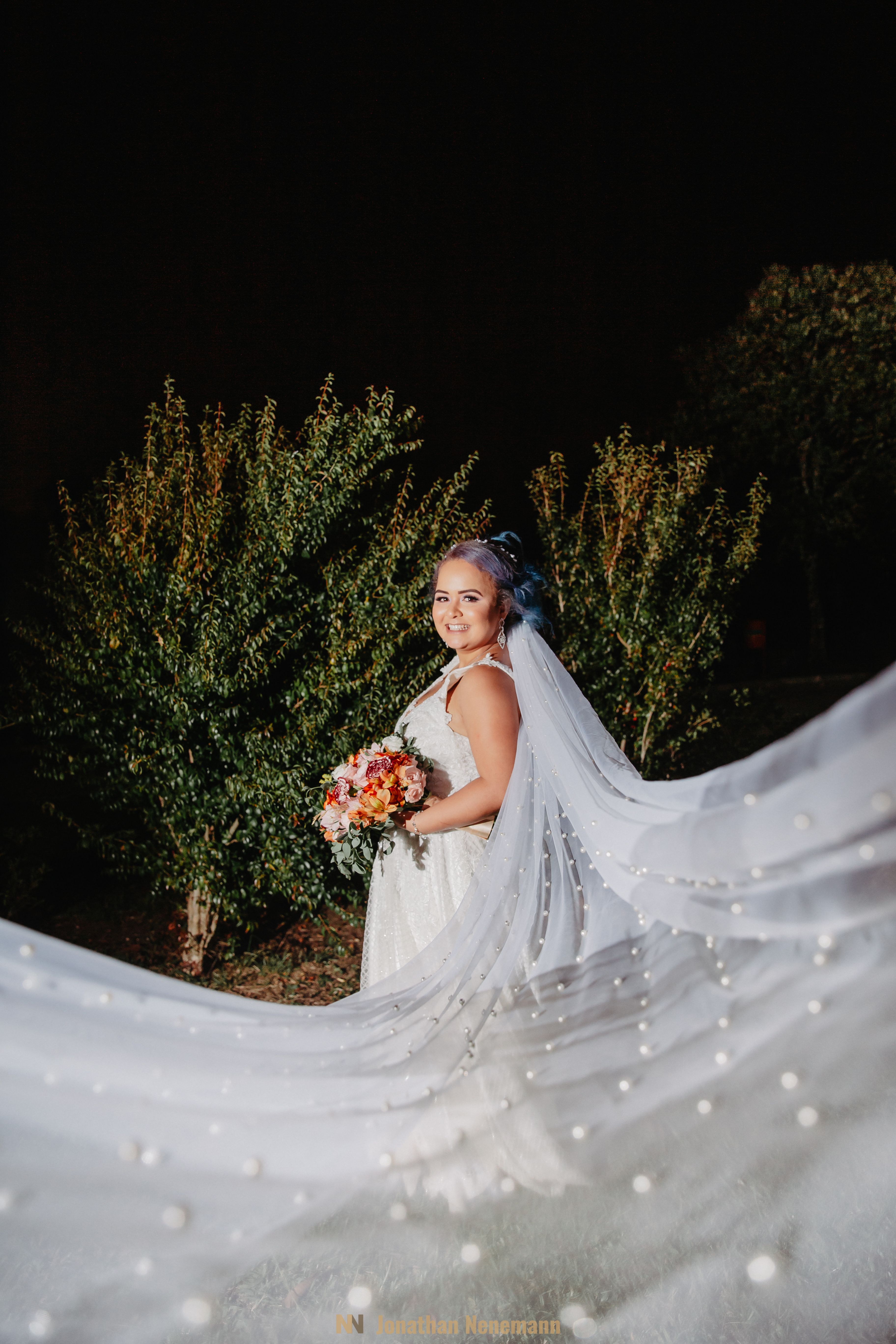 Woman in White Wedding Dress Holding Bouquet of Flowers · Free Stock Photo