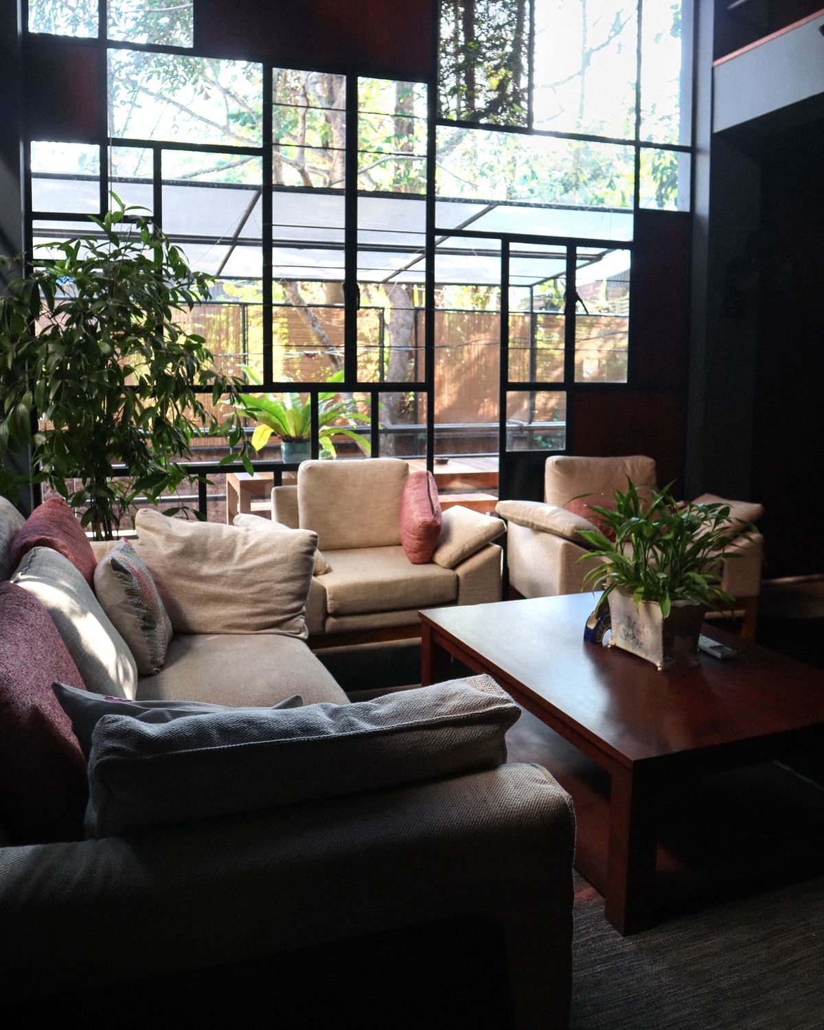 A softly lit living scene — natural light, linen, a moment of calm.